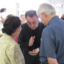 Fr. performing baptism